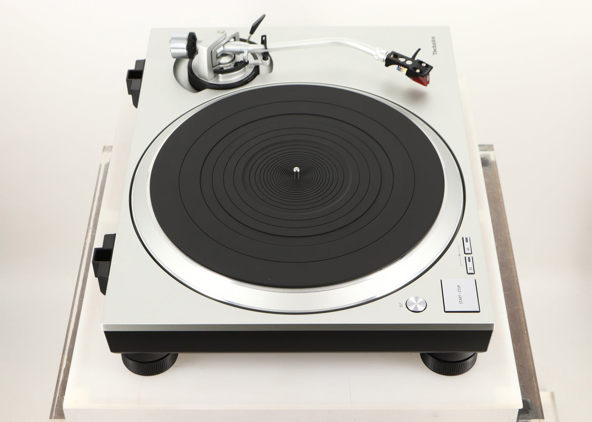 Left side view of a used Technics SL-1500C Turntable in a silver finish