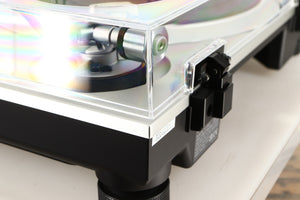 Rear right corner of a used Technics SL-1500C Turntable in a silver finish