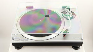 Front view of a used Technics SL-1500C Turntable in a silver finish showing lid