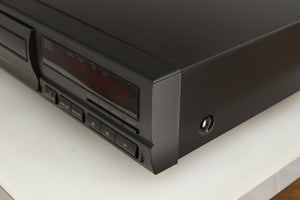 Front right corner of a used Technics SL-PG390EB-K CD Player in a grey finish