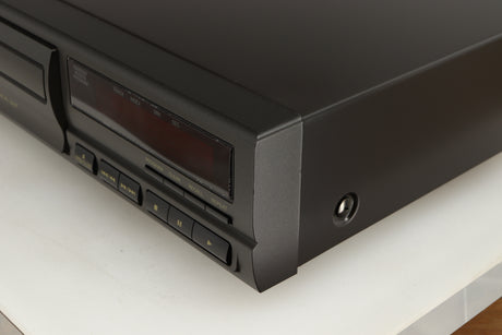 Front right corner of a used Technics SL-PG390EB-K CD Player in a grey finish