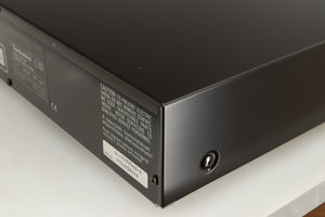 Rear left corner of a used Technics SL-PG390EB-K CD Player in a grey finish