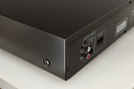 Rear right corner of a used Technics SL-PG390EB-K CD Player in a grey finish