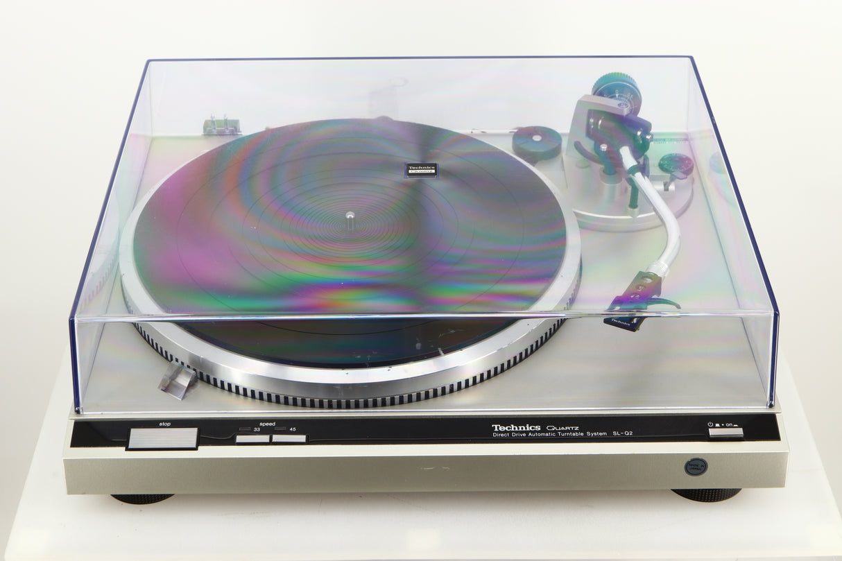 Top view of a used Technics SL-Q2 Direct Driver Turntable in Silver with lid