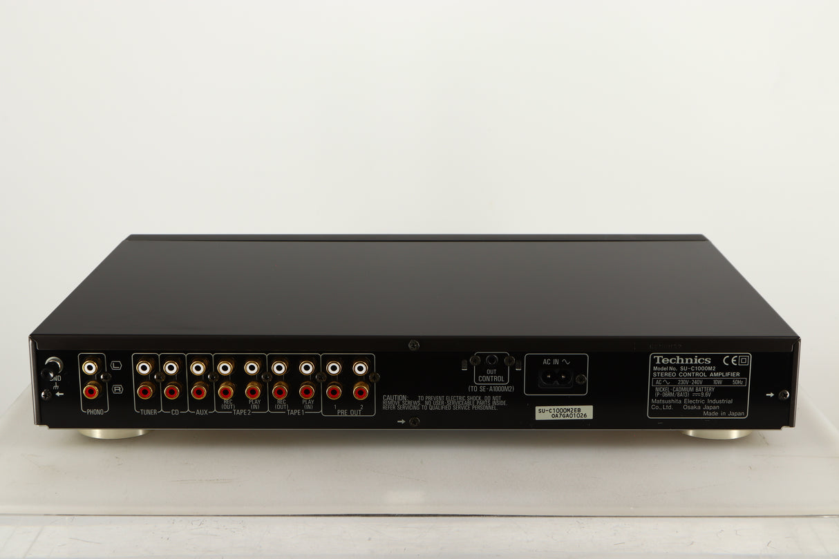 Rear view of a used Technics SU-C1000M2 Pre Amplifier in a black finish showing Phono Inputs, Phono Outputs and Power Cable