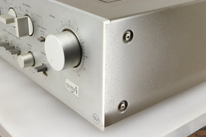 Front right corner of a used Technics SU-V4 Integrated Amplifier in a silver finish