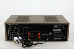 Rear view of a used Technics SU-V4 Integrated Amplifier in a silver finish showing Phono Inputs and Speaker Inputs