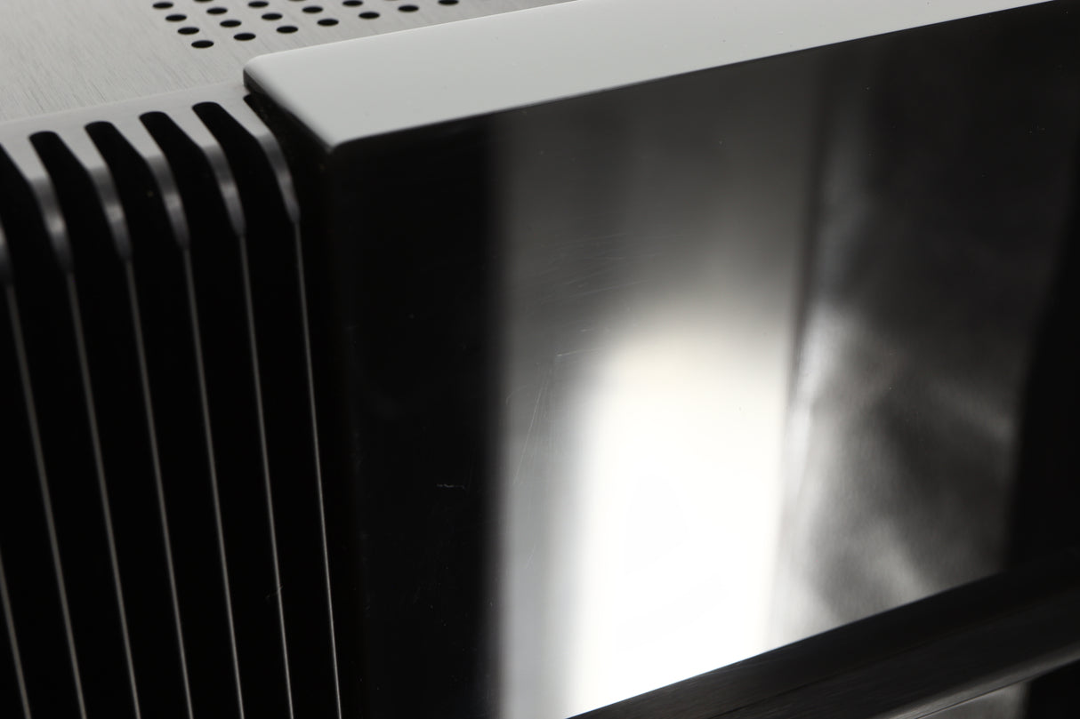 Close up view of a used The Gryphon Diablo 300 Integrated Amplifier showing some light scratching 