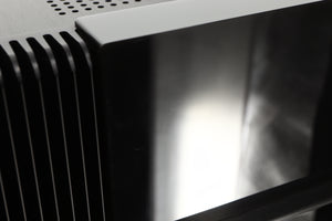 Close up view of a used The Gryphon Diablo 300 Integrated Amplifier showing some light scratching 
