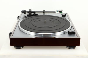 Side view of a used Thorens TD-102A Turntable in Walnut finish