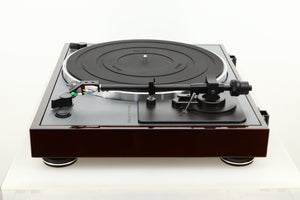 Side view of a used Thorens TD-102A Turntable in Walnut finish