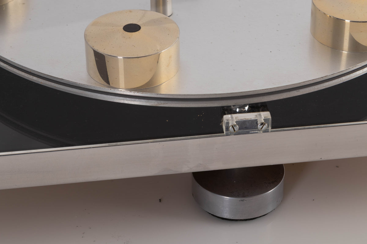 Close up view of a used Transcriptor Hydraulic Reference Turntable with Fluid Tonearm showing some marks to the metal finish
