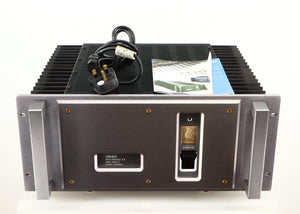 Top of a used Usher R1.5 Power Amplifier in a silver finish