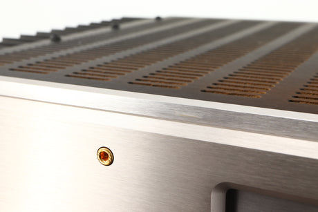 Close up of a used Usher R1.5 Power Amplifier in a silver finish showing small scratch on fascia