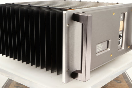 Front left corner of a used Usher R1.5 Power Amplifier in a silver finish