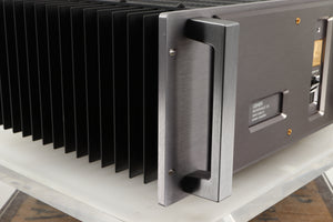 Front left corner of a used Usher R1.5 Power Amplifier in a silver finish