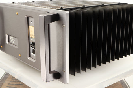 Front right corner of a used Usher R1.5 Power Amplifier in a silver finish