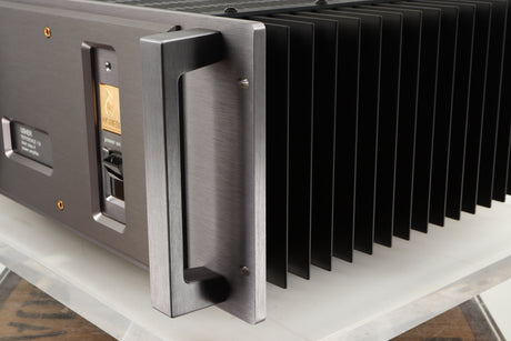 Front right corner of a used Usher R1.5 Power Amplifier in a silver finish