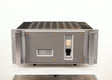 Front view of a used Usher R1.5 Power Amplifier in a silver finish