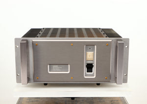 Front view of a used Usher R1.5 Power Amplifier in a silver finish