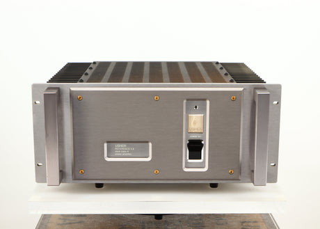 Front view of a used Usher R1.5 Power Amplifier in a silver finish