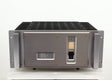Front view of a used Usher R1.5 Power Amplifier in a silver finish