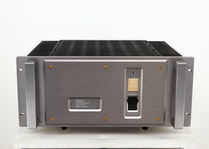 Front view of a used Usher R1.5 Power Amplifier in a silver finish