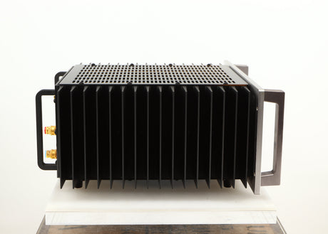 Left side view of a used Usher R1.5 Power Amplifier in a silver finish