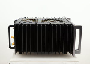 Left side view of a used Usher R1.5 Power Amplifier in a silver finish