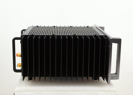 Left side view of a used Usher R1.5 Power Amplifier in a silver finish