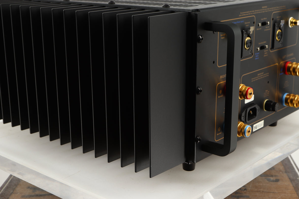 Rear right corner of a used Usher R1.5 Power Amplifier in a silver finish