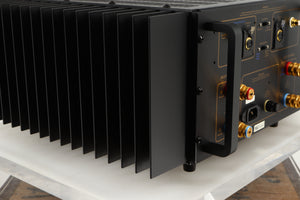 Rear right corner of a used Usher R1.5 Power Amplifier in a silver finish