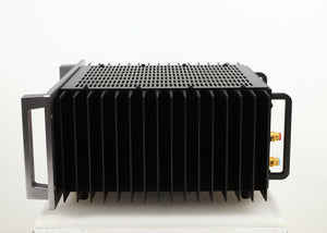 Right side view of a used Usher R1.5 Power Amplifier in a silver finish