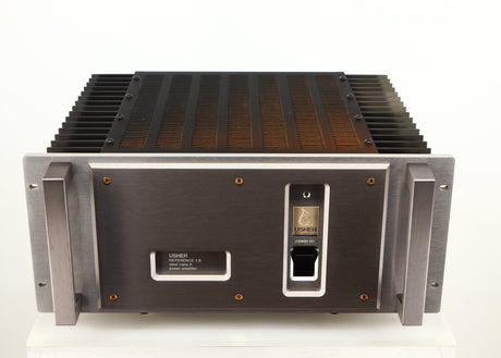 Top of a used Usher R1.5 Power Amplifier in a silver finish