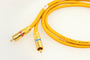 Close up of a used Van Den Hul D-102 MKIII Interconnect 0.8m Cable in a yellow finish showing the connectors