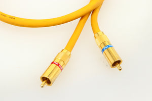 Close up of a used Van Den Hul D-102 MKIII Interconnect 0.8m Cable in a yellow finish showing the connectors