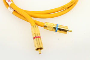 Close up of a used Van Den Hul D-102 MKIII Interconnect 0.8m Cable in a yellow finish showing the connectors