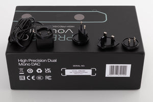 Box for a used Volumio Preciso Digital Analogue Converter in a Silver finish showing PSU, Schuko Plug and Mains Plug