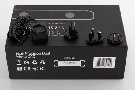 Box for a used Volumio Preciso Digital Analogue Converter in a Silver finish showing PSU, Schuko Plug and Mains Plug