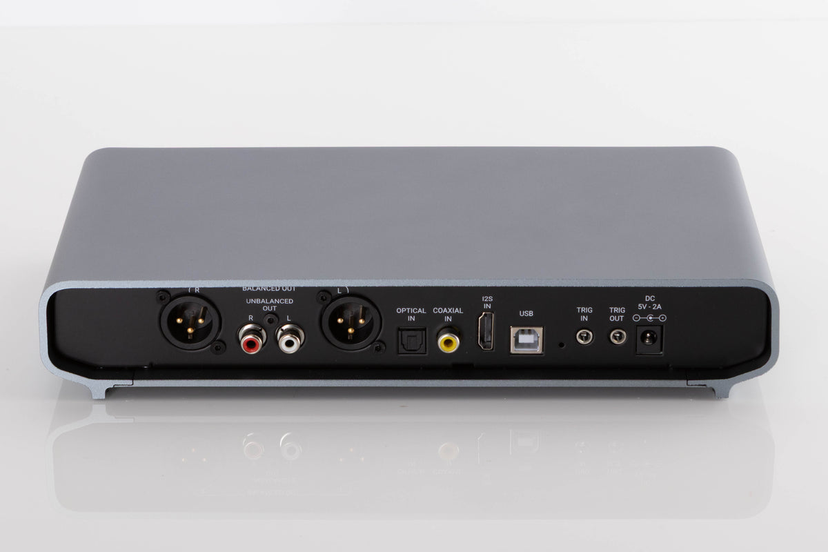 Rear view of a used Volumio Preciso Digital Analogue Converter in a Silver finish showing XLR Output, Phono Outputs, Optical Input, HDMI Input, Coaxial Input, USB Input and Power Input