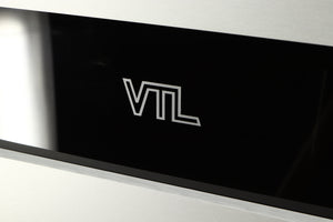 Close up of a used VTL ST85 Power Amplifier in a silver finish showing logo on fascia
