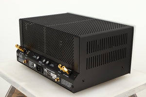 Rear left corner of a used VTL ST85 Power Amplifier in a silver finish 