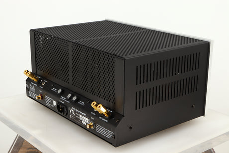 Rear left corner of a used VTL ST85 Power Amplifier in a silver finish 