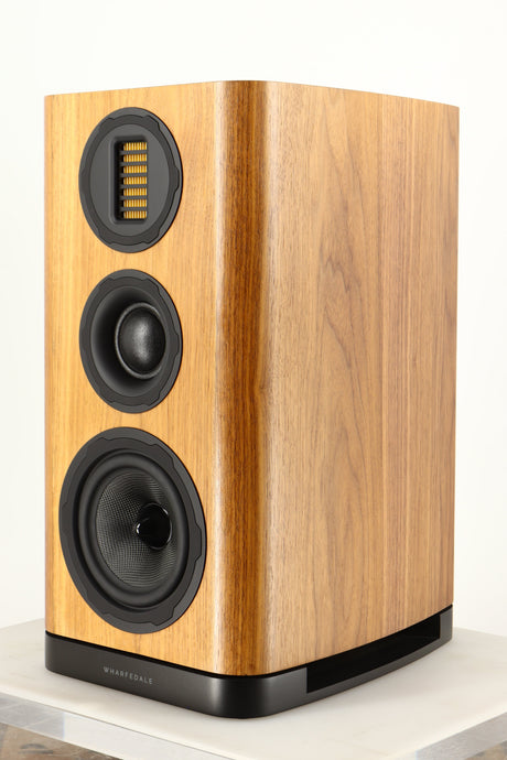 Front right corner of a used Wharfedale EVO 5.2 Standmount Speaker in a walnut finish