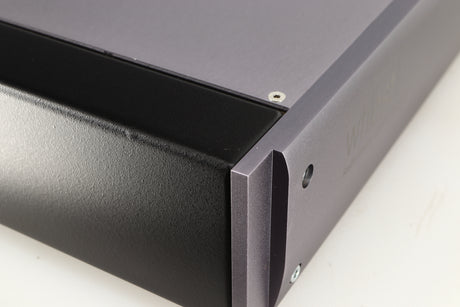 Close up of a used Whest PS.30R Phonostage showing small bump on left edge