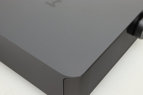Close up of a used Wiim Amp Ultra Streaming Amplifier in a grey finish showing small scratch on top
