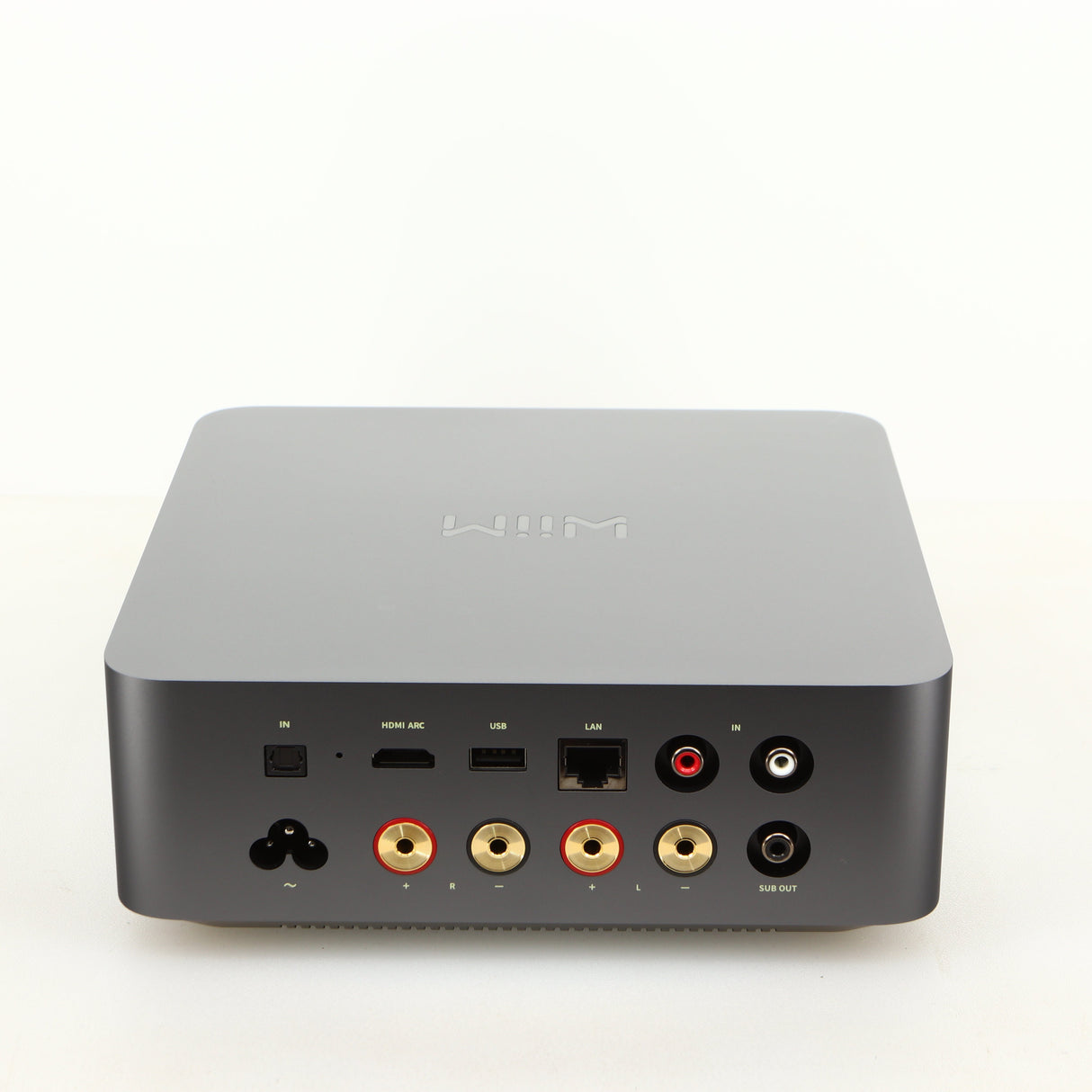 Rear view of a used Wiim Amp Ultra Streaming Amplifier in a grey finish showing USB Output, Optical Input, Network Input, Phono Inputs, Phono Output and Power Input