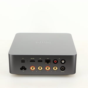 Rear view of a used Wiim Amp Ultra Streaming Amplifier in a grey finish showing USB Output, Optical Input, Network Input, Phono Inputs, Phono Output and Power Input