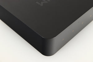 Close up of a used Wiim Pro Plus Streamer in a black finish showing light scratches on left side