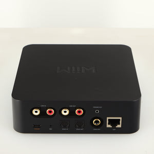 Rear view of a used WiiM Pro Streamer showing USB Input, Phono Inputs, Phono Outputs, Network Input, Optical Input and Optical Output